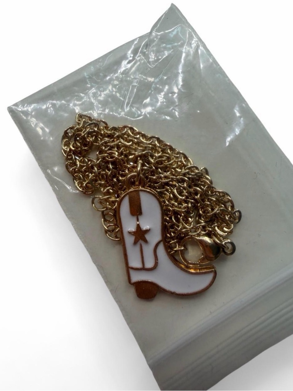 Gold chain with white and gold cowgirl boot charm  never worn